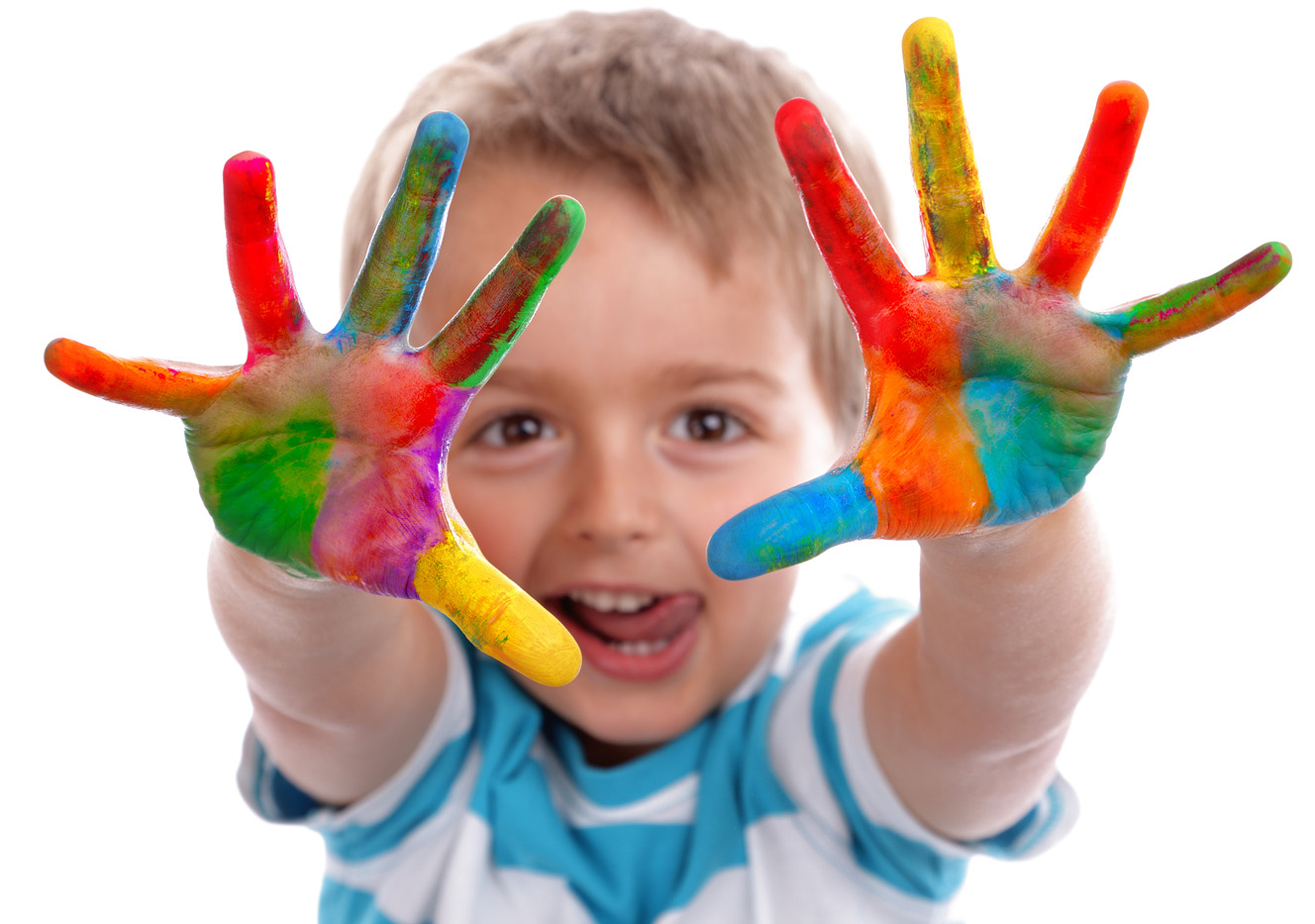 Boy with hands painted in colorful paints ready to make hand pri